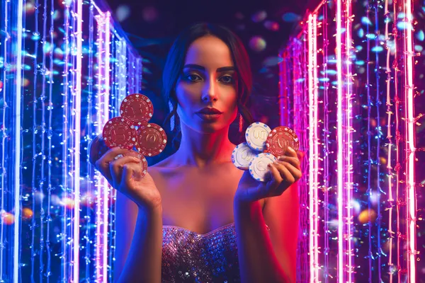 BA99 App — Fast, responsive, and optimized for all devices A cheerful woman in traditional clothing using her smartphone during a festive moment, showing how easily the BA99 app fits into everyday life.