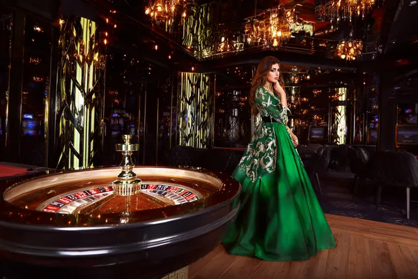 BA99 Live Casino — Join thrilling real-dealer tables A professional dealer in a tuxedo greeting players at the roulette table, symbolizing the authentic live casino feel at BA99.