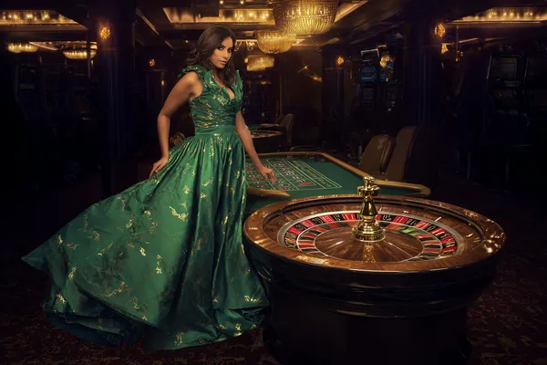 BA99 Games — Discover modern slots and table adventures A man celebrating a winning moment on his laptop while gaming symbols float around him, capturing the excitement of BA99 games.